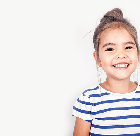 smiling girl confident about her easy visit to village pediatric dentistry