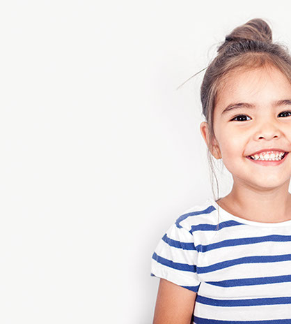 smiling girl confident about her easy visit to village pediatric dentistry