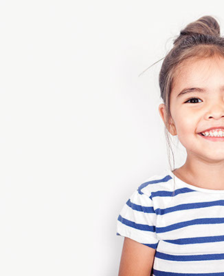 smiling girl confident about her easy visit to village pediatric dentistry