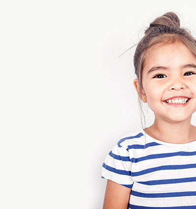 smiling girl confident about her easy visit to village pediatric dentistry