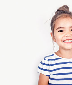 smiling girl confident about her easy visit to village pediatric dentistry